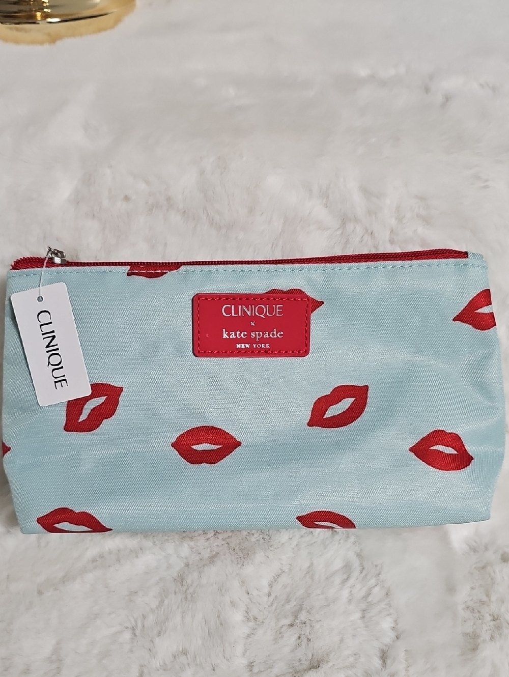 kate spade Light Blue Cosmetic Pouch with Red Lip Print